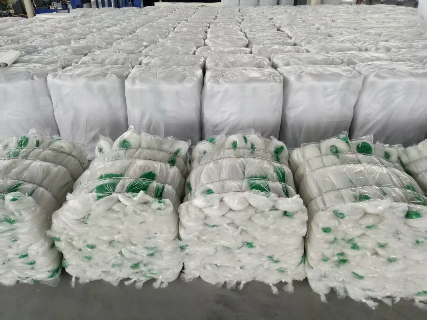 Rolls of netting bundled and wrapped, ready for palletising