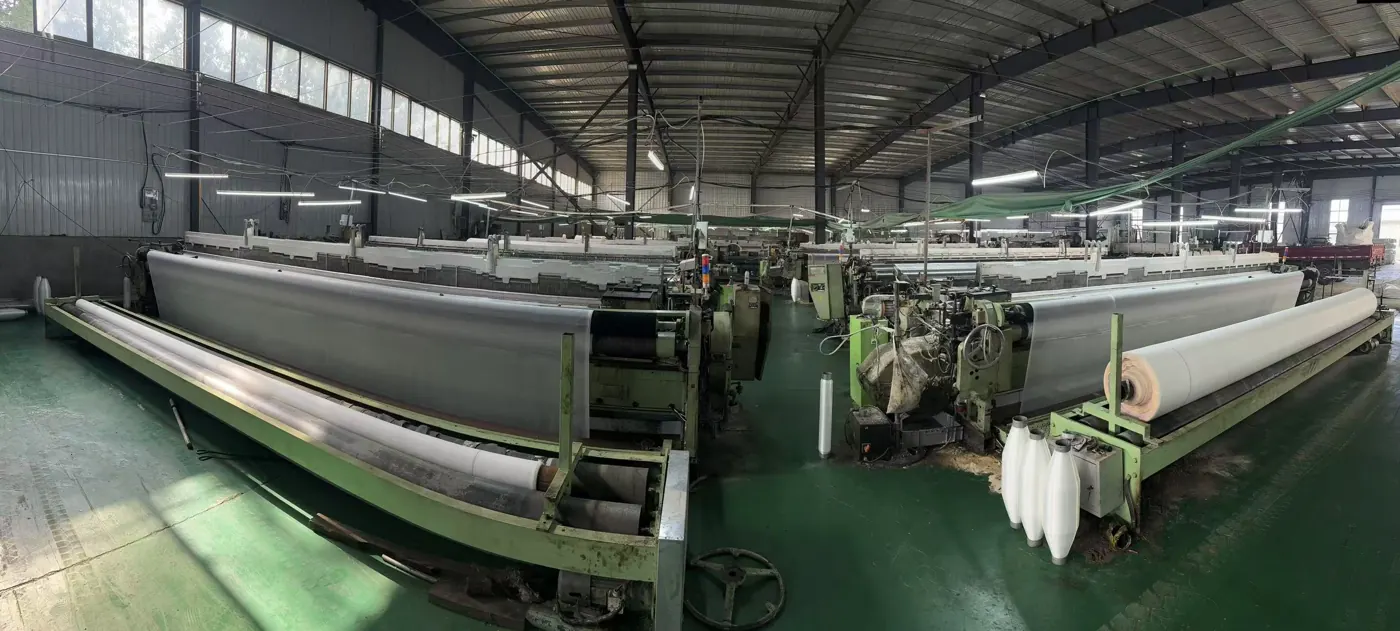 Weaving looms producing agricultural netting at our manufacturing partner's production site